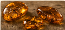 A group of polished golden amber stones